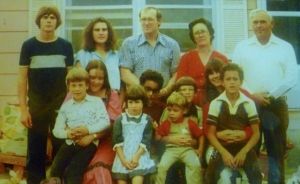Barbara and Bill Roberts (back row, right) with their children, including my dad, back row middle.